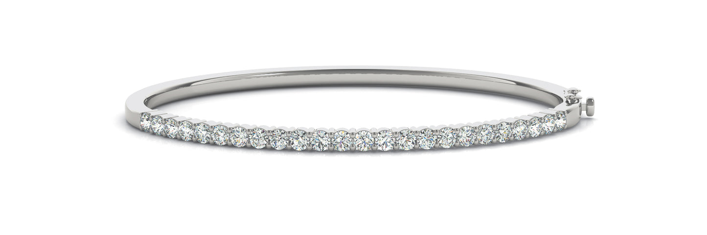 white gold bangle with a row of sparkling diamonds on the top half, set against a white background. Elegant and sophisticated design.