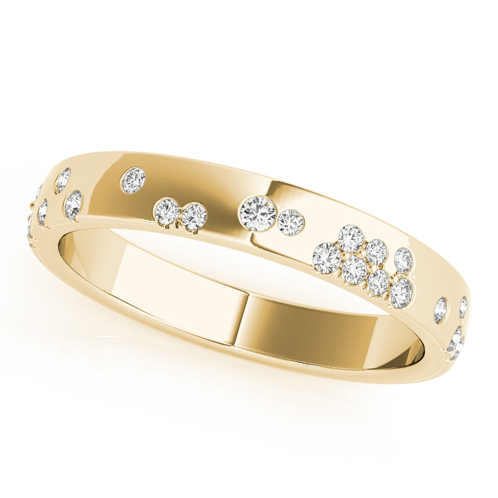 A gold ring with a sleek band, featuring small, round diamonds set in scattered clusters and individually around the ring, creating a sparkling effect.