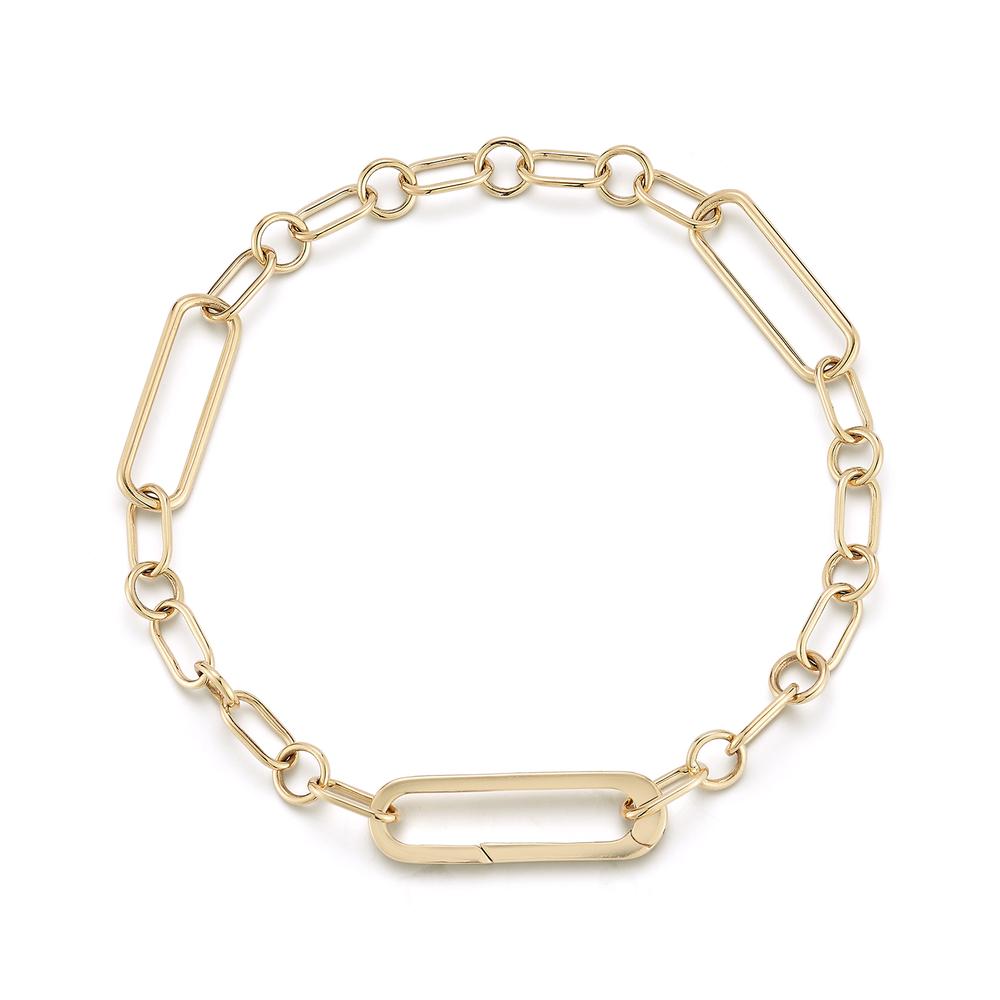 Gold bracelet featuring a chain design with oval and round links, displayed on a white background. It conveys elegance and simplicity.