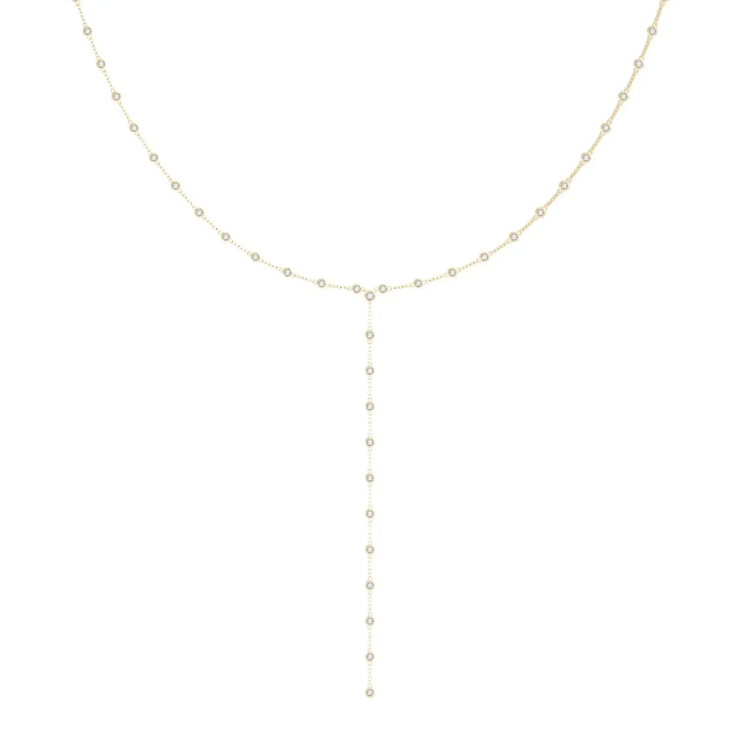 Delicate gold lariat necklace on white background. Features a chain with bezel set diamonds, a Y-shaped drop lariat, and a minimalist, elegant design.