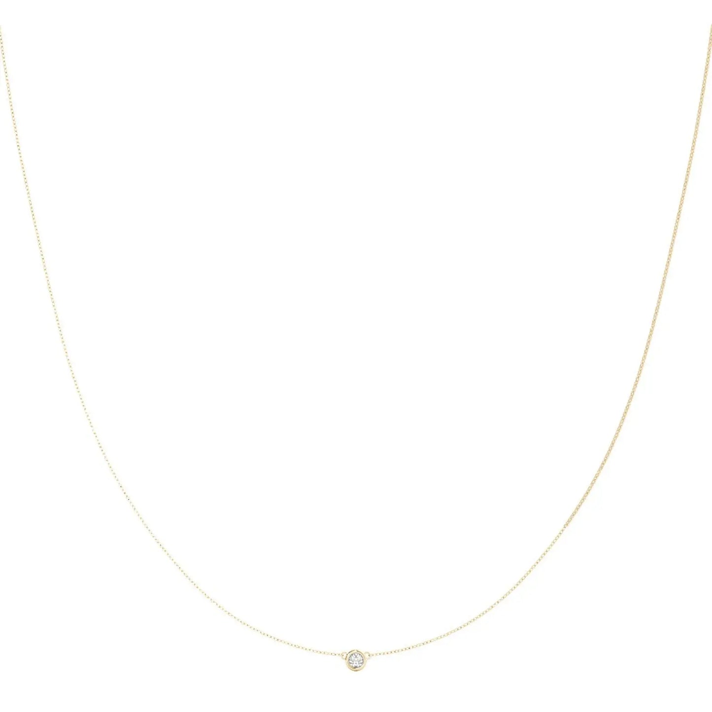 Delicate gold necklace with bezel set diamond, displayed on a white background. The elegant design conveys sophistication and grace.
