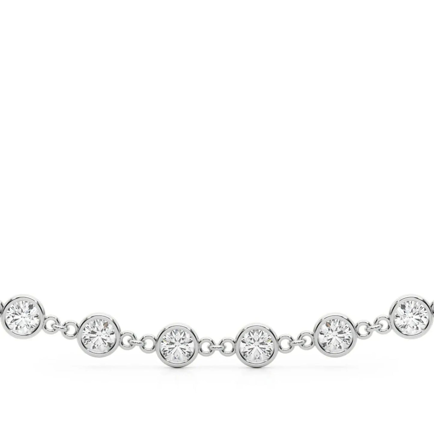 A delicate gold paperclip chain necklace with bezel set diamonds displayed on a plain white background, with fine, interlocking links creating a simple yet elegant design.