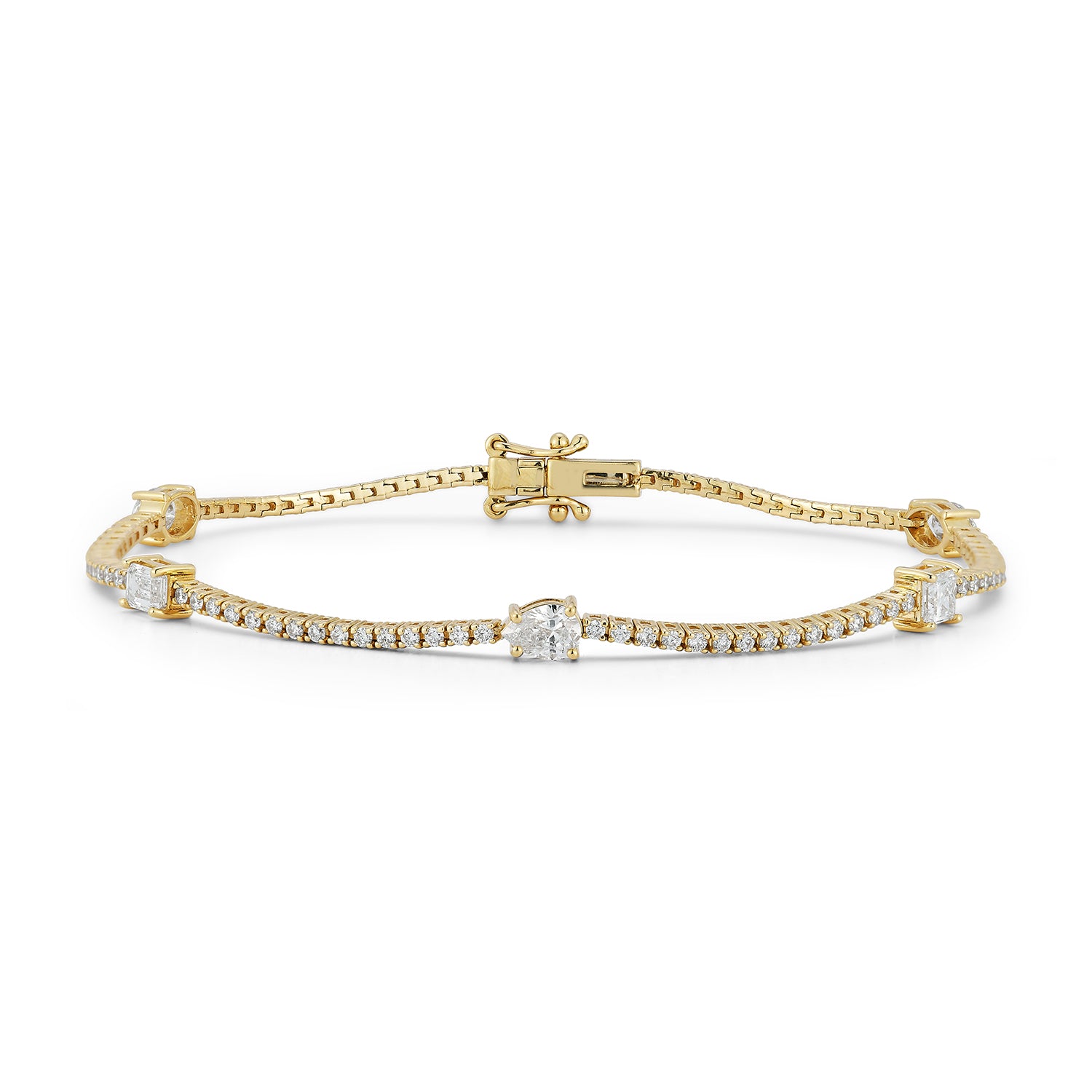 A delicate gold tennis bracelet features small diamonds set along the band, with larger diamonds spaced intermittently, creating an elegant, luxurious appearance.