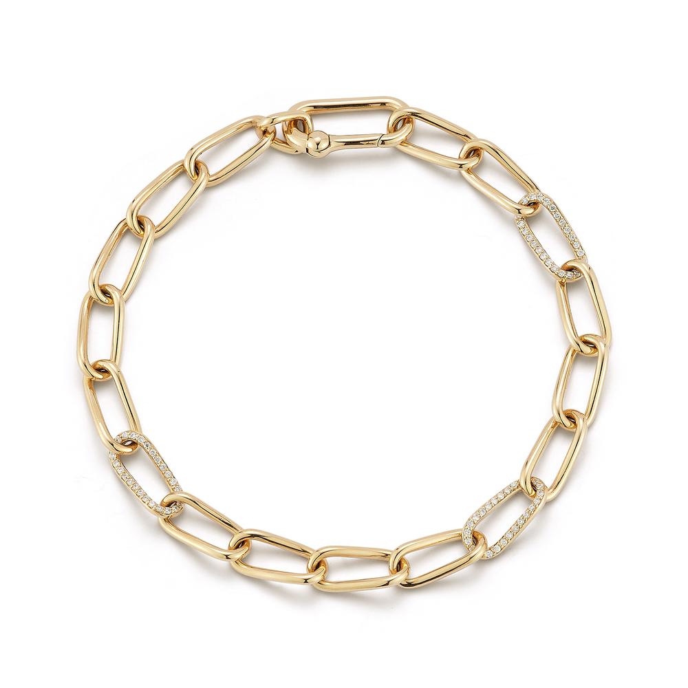 Elegant gold chain necklace with elongated links. Several links are adorned with small sparkling diamonds, adding a touch of luxury and sophistication.