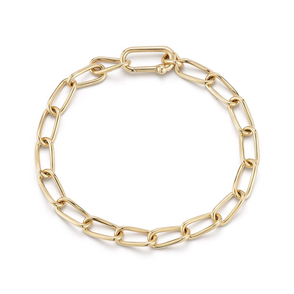 Simple gold chain bracelet with elongated links and a rectangular clasp. The design is elegant and minimalist, conveying a sense of modern luxury.