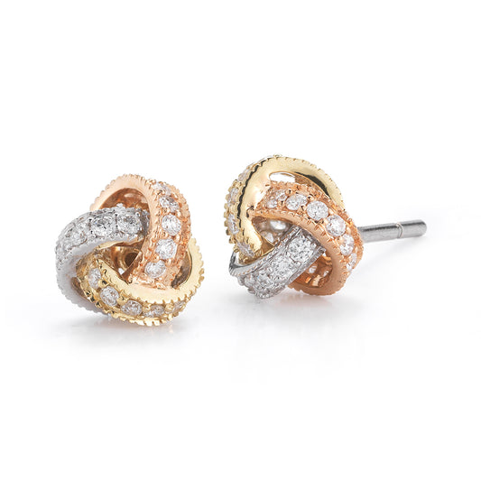 Elegant knot stud earrings with intertwined gold, silver, and rose gold bands, encrusted with sparkling diamonds, creating a luxurious, timeless look.