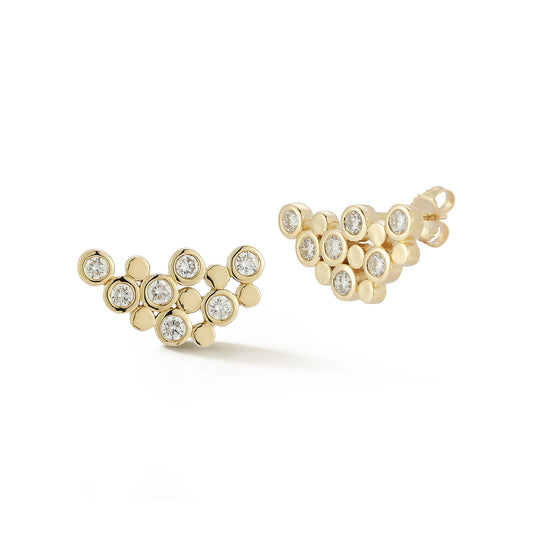 Gold earrings with a cluster of round diamonds set in individual bezels, forming a triangular design. They convey elegance and modern sophistication.