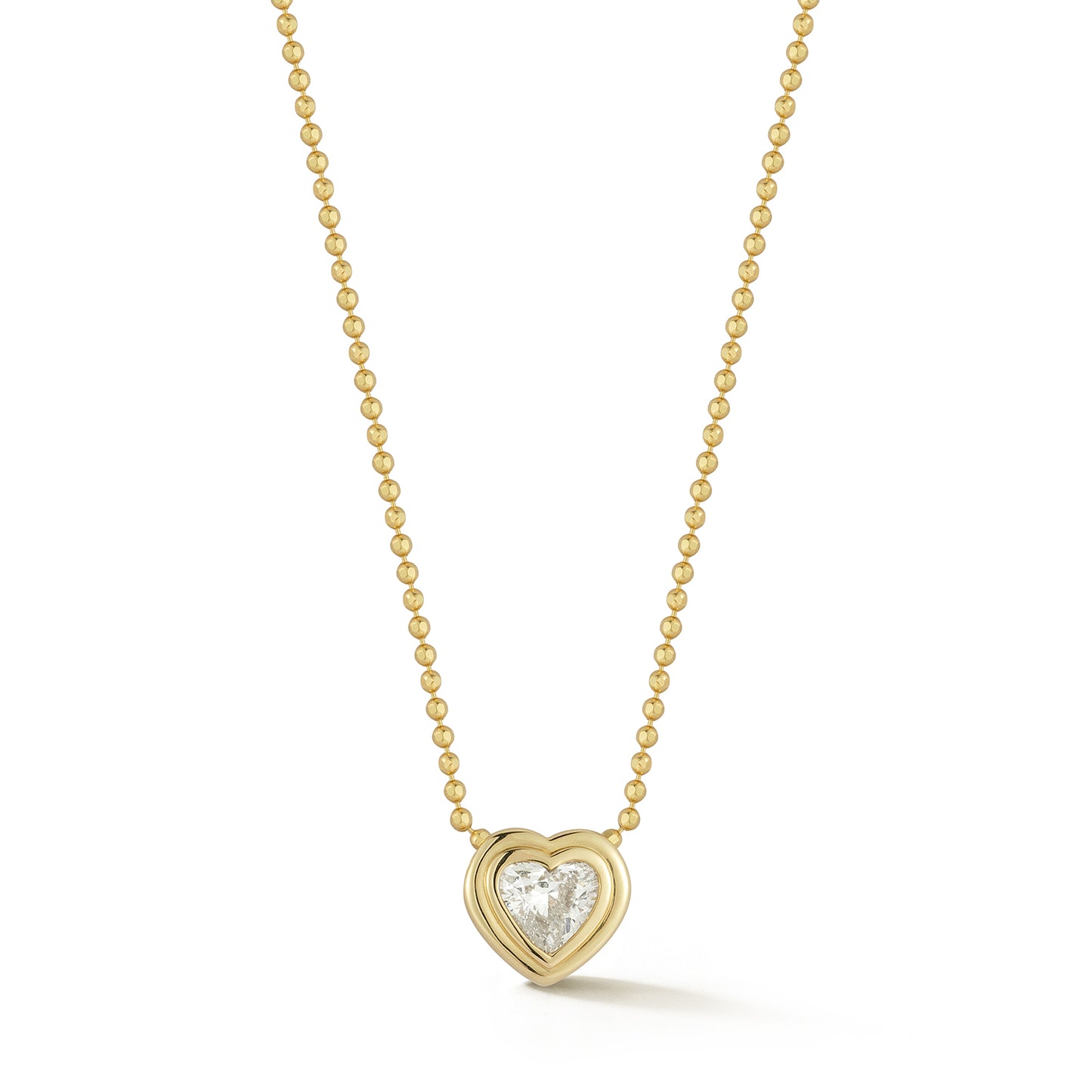 A gold chain necklace with a heart diamond pendant set in a gold bezel, displayed against a white background, conveying elegance and simplicity.